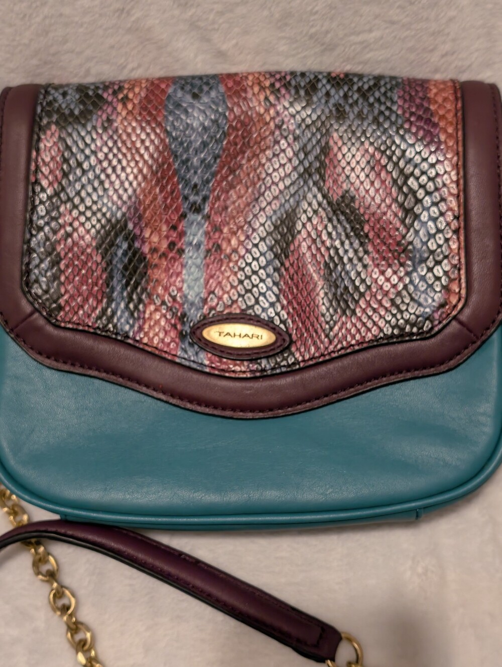 Tahari Teal Crossbody with Multicolor Snake-Print Flap and Plum Trim.